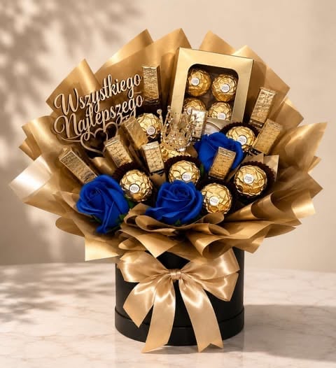 Gold and blue chocolate gift arrangement with Ferrero Rocher candies, decorative box, and blue roses in a black vase